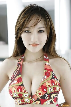 Asian hottie is looking sexy in her bikini and dress