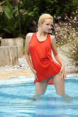 Splashing around in a pool, this lovely doll shows her tantalizing curves